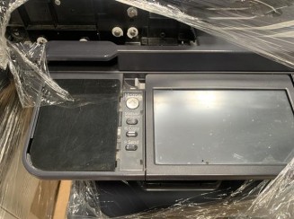 Uma impressora KYOCERA/M3040IDN no estado.